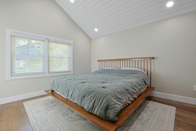 bedroom featuring recessed lighting, baseboards, wood finished floors, and high vaulted ceiling