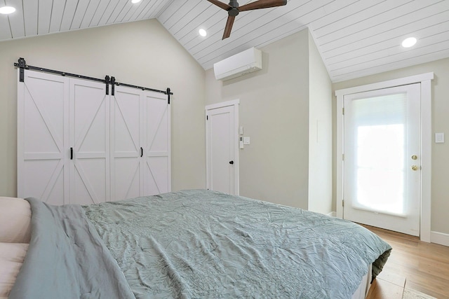 bedroom featuring recessed lighting, a wall unit AC, light wood-type flooring, lofted ceiling, and wood ceiling