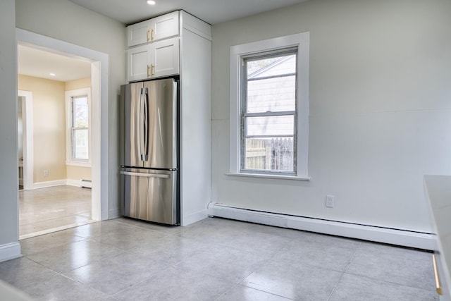 71 Lenox Ave, Congers, NY 10920 - kitchen with freestanding refrigerator, a baseboard radiator, white cabinets, plenty of natural light, and recessed lighting
