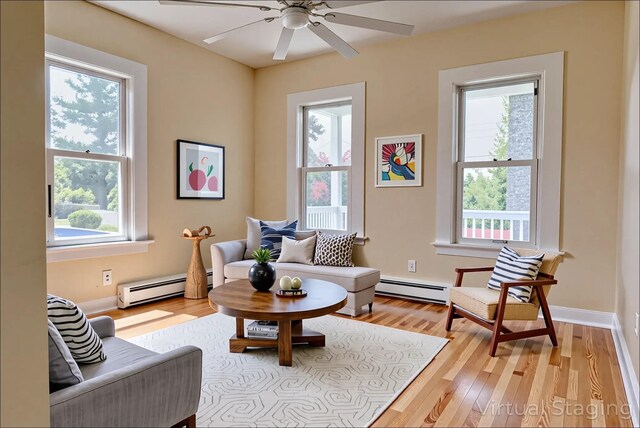 71 Lenox Ave, Congers, NY 10920 - living area featuring baseboard heating, a ceiling fan, light wood-style flooring, and baseboards