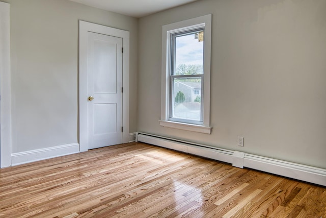 71 Lenox Ave, Congers, NY 10920 - unfurnished room with a baseboard radiator and light wood-style flooring
