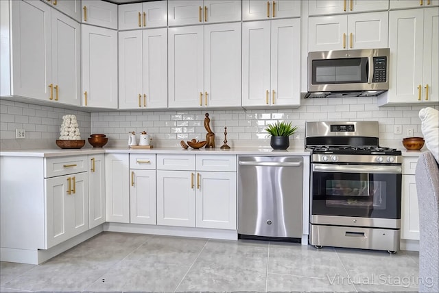 71 Lenox Ave, Congers, NY 10920 - kitchen with stainless steel appliances, light countertops, light tile patterned flooring, and tasteful backsplash