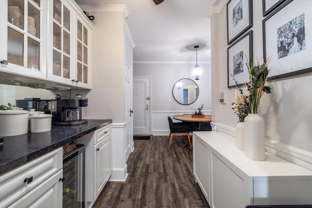 261 Central Ave Unit E4, Lawrence, NY 11559 - bar with beverage cooler, dark wood-style floors, ornamental molding, and a wainscoted wall