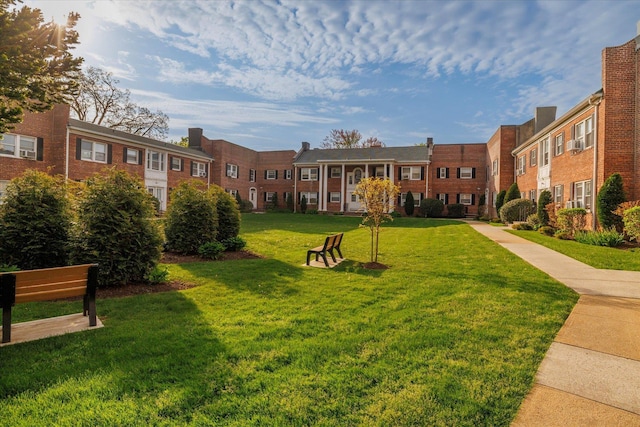 261 Central Ave Unit E4, Lawrence, NY 11559 - view of community with a residential view and a lawn