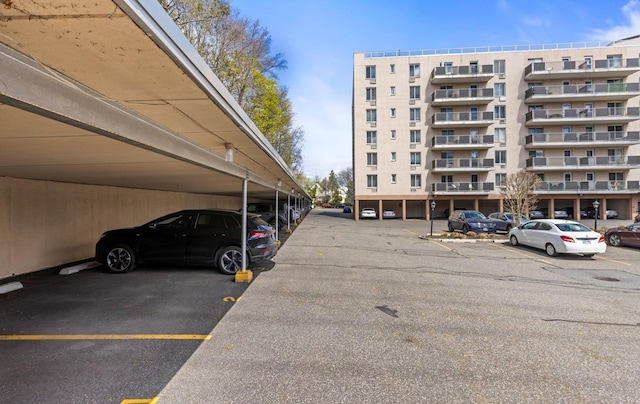 135 Post Ave Unit 5N, Westbury, NY 11590 - view of building exterior with covered parking