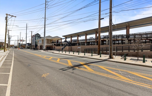 135 Post Ave Unit 5N, Westbury, NY 11590 - view of road with street lighting, sidewalks, and curbs