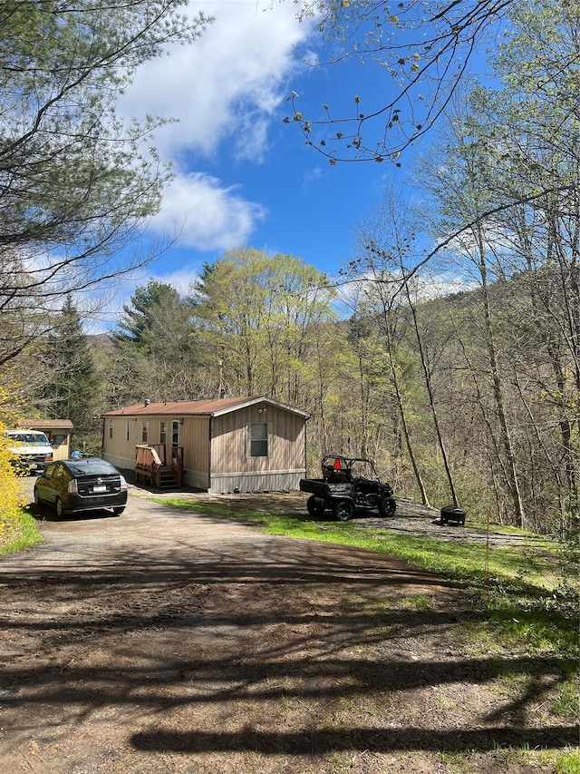 view of side of property featuring driveway