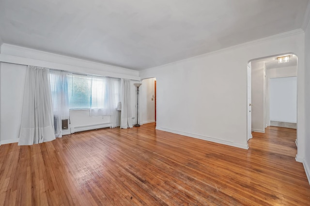 unfurnished room featuring a baseboard radiator, arched walkways, hardwood / wood-style flooring, and ornamental molding
