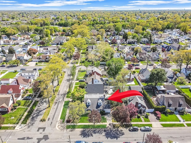 birds eye view of property with a residential view