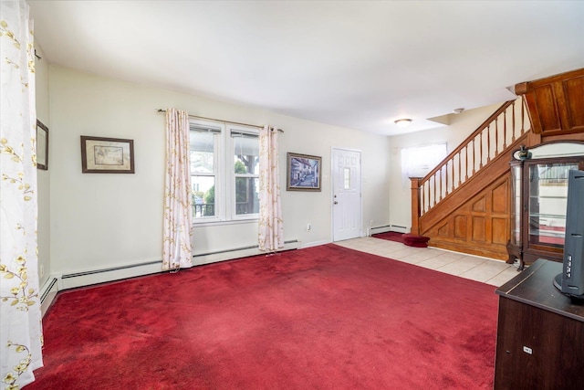 carpeted foyer featuring baseboards, tile patterned flooring, a baseboard heating unit, and stairs