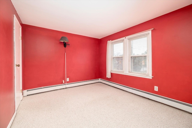 empty room featuring carpet floors, a baseboard radiator, and baseboards