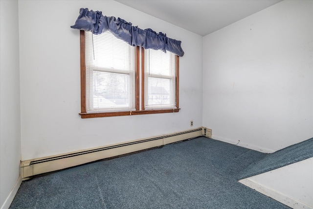 carpeted empty room with baseboards and a baseboard radiator