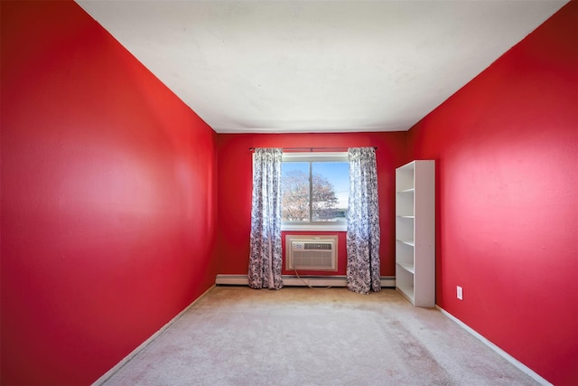 2433 Union Blvd Unit 4B, Islip, NY 11751 - spare room with carpet flooring, baseboards, a wall unit AC, and a baseboard radiator