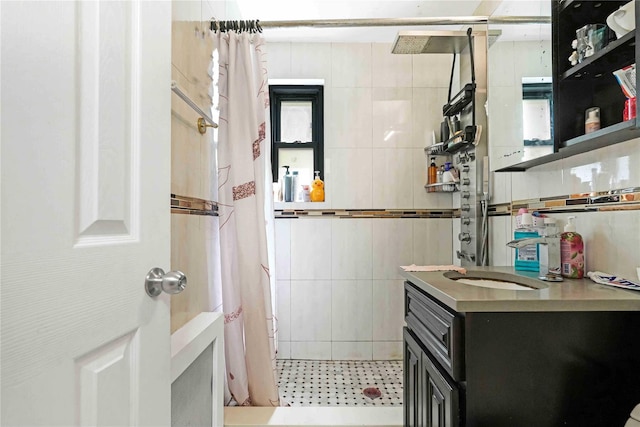 58-37 246th Cres Unit 1F, Little Neck, NY 11362 - bathroom with tile patterned floors, tile walls, tiled shower, and vanity