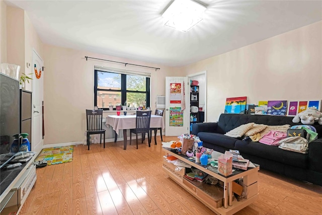 58-37 246th Cres Unit 1F, Little Neck, NY 11362 - living room with light wood-type flooring