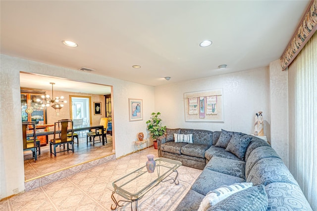 living room with recessed lighting, a chandelier, and visible vents