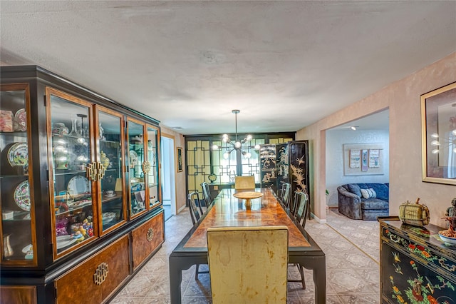 dining area with a chandelier