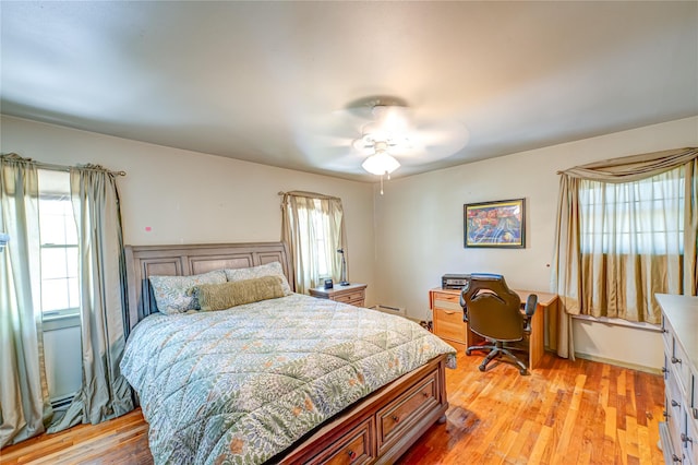 bedroom featuring ceiling fan and light wood-style flooring