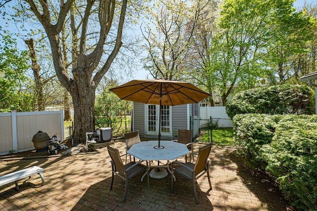 view of patio / terrace featuring fence and outdoor dining space