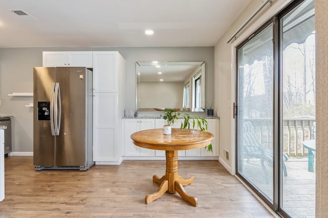 dining area featuring recessed lighting, baseboards, visible vents, and light wood-style floors