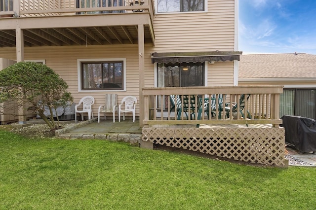rear view of house with a patio area and a yard