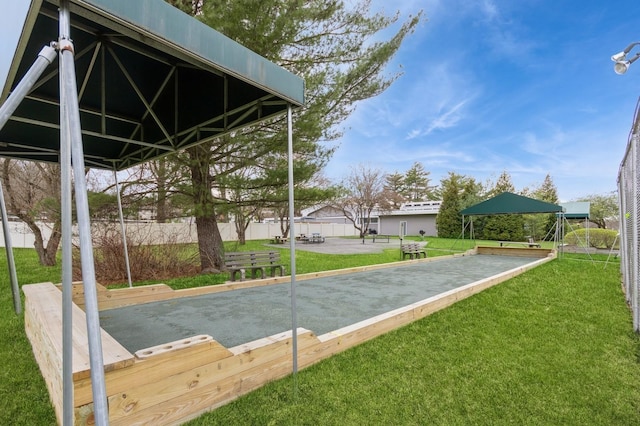 exterior space featuring a yard and fence