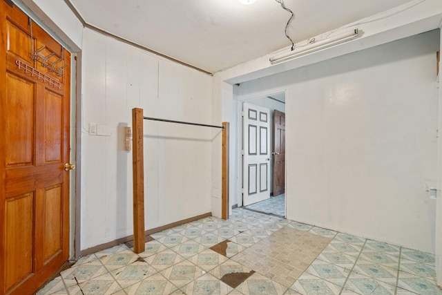 unfurnished room featuring light floors