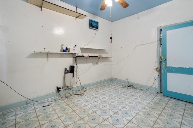 laundry room featuring light floors and ceiling fan