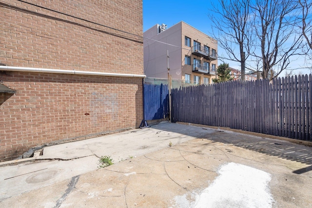 view of patio / terrace featuring fence