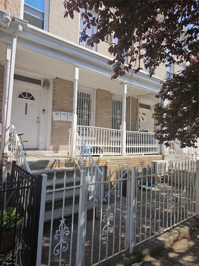 355 Ridgewood Ave, Brooklyn, NY 11208 - property entrance with a porch and brick siding
