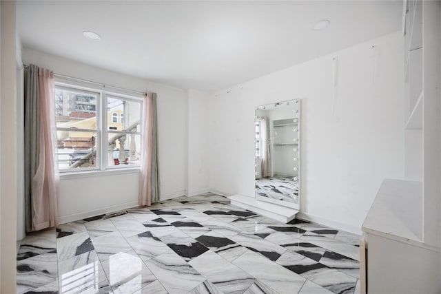 spare room featuring recessed lighting