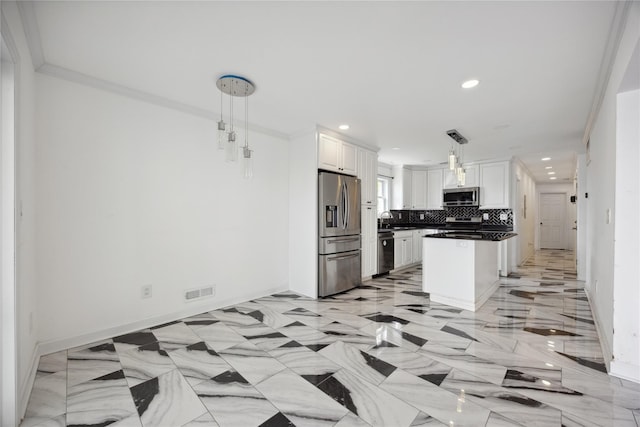 kitchen featuring white cabinets, a sink, stainless steel appliances, recessed lighting, and backsplash