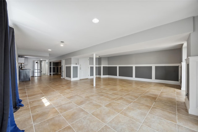 interior space featuring light tile patterned floors and recessed lighting