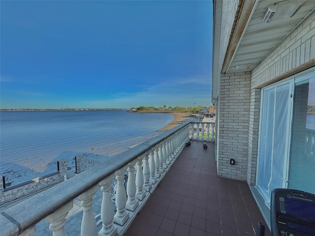 balcony featuring a water view