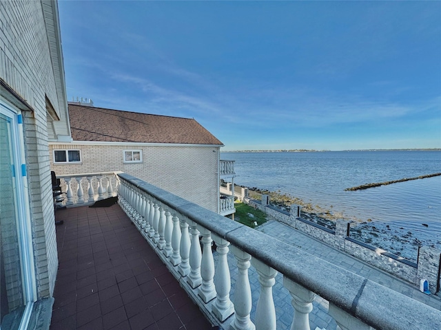 balcony featuring a water view
