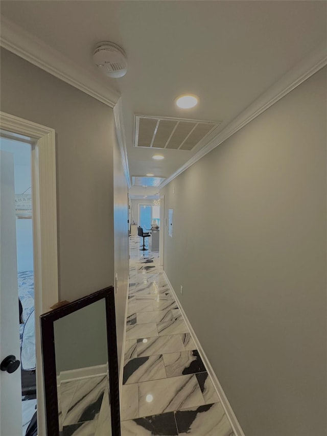 hallway with visible vents, ornamental molding, marble finish floor, baseboards, and recessed lighting