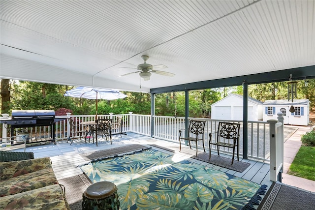 8 Rose Ct, Northport, NY 11768 - view of patio featuring a storage unit, outdoor dining space, ceiling fan, grilling area, and an outbuilding