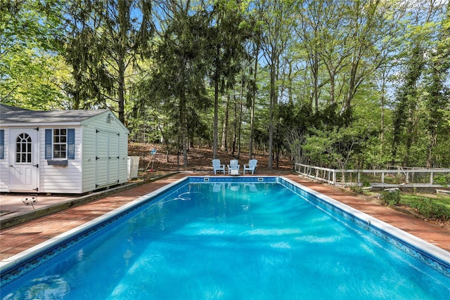 8 Rose Ct, Northport, NY 11768 - view of swimming pool with a fenced in pool, fence, and an outdoor structure