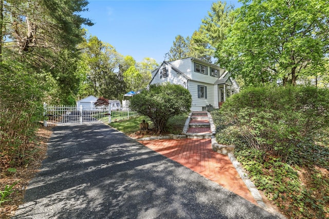 8 Rose Ct, Northport, NY 11768 - view of front of house featuring fence and an outdoor structure