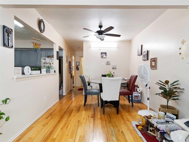 81-56 102nd Rd, Ozone Park, NY 11416 - dining room featuring baseboards, a ceiling fan, and light wood-type flooring