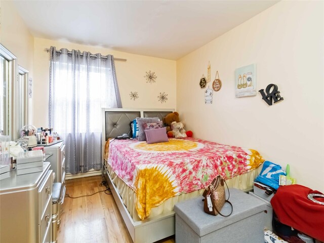 81-56 102nd Rd, Ozone Park, NY 11416 - bedroom with light wood finished floors