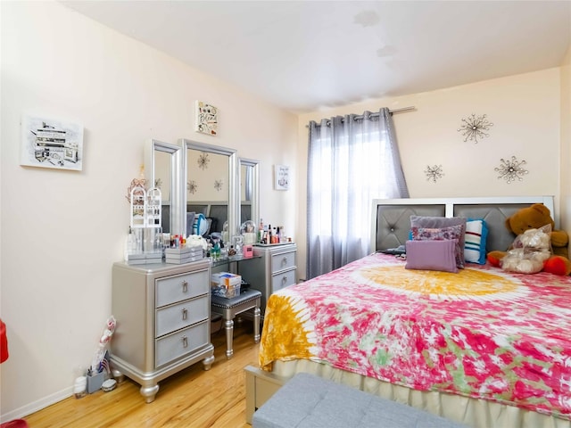 81-56 102nd Rd, Ozone Park, NY 11416 - bedroom featuring baseboards and wood finished floors