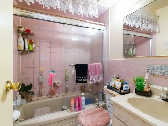 81-56 102nd Rd, Ozone Park, NY 11416 - full bath featuring tile walls, a sink, and bath / shower combo with glass door