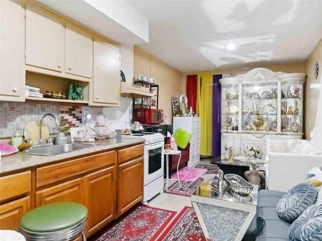81-56 102nd Rd, Ozone Park, NY 11416 - kitchen with white range, open shelves, a sink, light countertops, and tasteful backsplash
