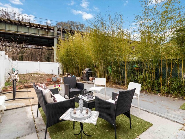 81-56 102nd Rd, Ozone Park, NY 11416 - view of patio with a fenced backyard and an outdoor hangout area
