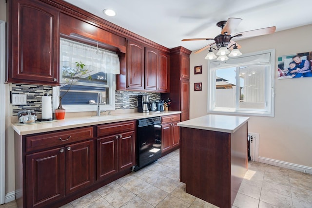 kitchen featuring ceiling fan, tasteful backsplash, a sink, dishwasher, and reddish brown cabinets