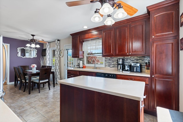 kitchen featuring a ceiling fan, decorative backsplash, dark brown cabinets, and light countertops