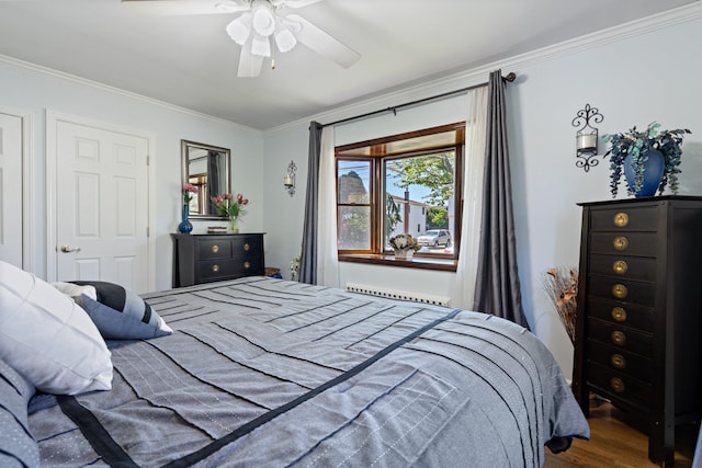 bedroom with crown molding, ceiling fan, and wood finished floors