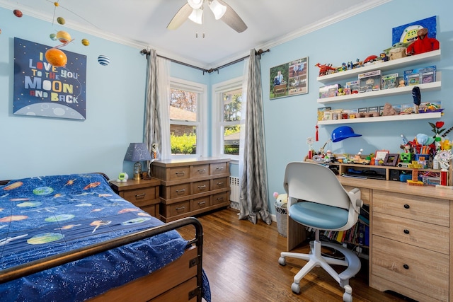 bedroom featuring crown molding, a ceiling fan, and dark wood-type flooring