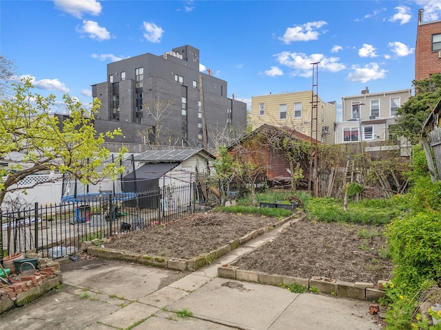 view of property's community with fence and a residential view